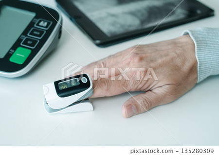 oxygen saturation monitored during a checkup 135280309