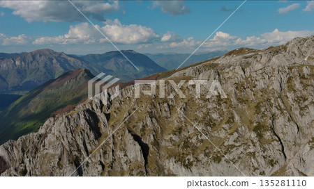 Rocky mountains and valley before sunset aerial 135281110
