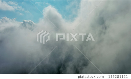 Clouds and blue sky, flying in clouds Clouds and blue sky, flying in clouds 135281121