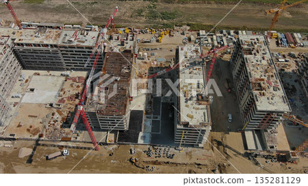 Industrial construction site with houses equipment and materials Industrial construction site with houses equipment and materials 135281129