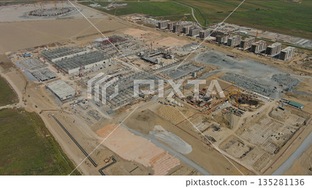 Industrial construction site with construction equipment and materials Industrial construction site with construction equipment and materials 135281136