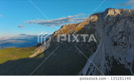 Aerial view of amazing rocky mountains at sunset Aerial view of amazing rocky mountains at sunset 135281140