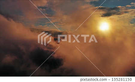 Aerial view of orange fluffy cloud in sky Aerial view of orange fluffy cloud in sky 135281150