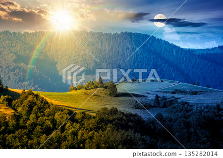 mountainous countryside landscape with rolling hills on summer solstice. day and night time change concept. rural area with sun and moon at twilight. beautiful view for equality and shift template mountainous countryside landscape with rolling hills on summer solstice. day and night time change concept. rural area with sun and moon at twilight. beautiful view for equality and shift template 135282014