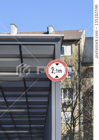 Height limit traffic sign on a modern canopy structure Height limit traffic sign on a modern canopy structure 135282596