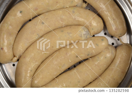 Traditional white sausages in a metal steamer pot Traditional white sausages in a metal steamer pot 135282598