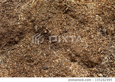 Pile of shredded vegetation to revitalize the garden Pile of shredded vegetation to revitalize the garden 135282995