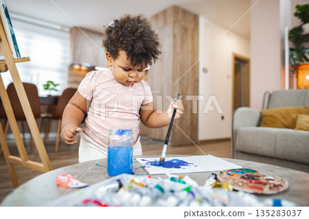 Young artist creating in afternoon light at home Young artist creating in afternoon light at home 135283037