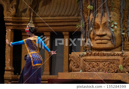 Rear view of actress showing Khon dancing performance in Siem Reap, Cambodia. The UNESCO announced Khon, the Thai masked dance drama, and Lkhon Khol of Cambodia are intangible cultural heritage. Rear view of actress showing Khon dancing performance in Siem Reap, Cambodia. The UNESCO announced Khon, the Thai masked dance drama, and Lkhon Khol of Cambodia are intangible cultural heritage. 135284399