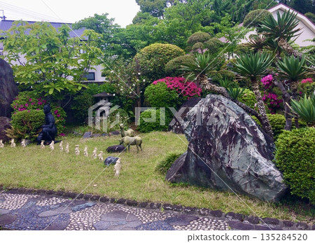 A Japanese-style garden lined with cute fawn figurines A Japanese-style garden lined with cute fawn figurines 135284520