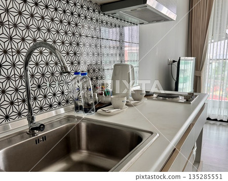 Stylish modern kitchen area in the studio apartment 135285551