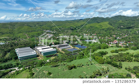 Building farm for chicken poultry houses and barn Philippines industrial aerial drone. Rural agriculture area, breeding chicken and fresh egg. Factory fabricated Cebu construction, additional poultry 135286379