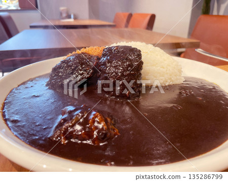 Pork fillet cutlet curry: A crispy pork cutlet with a dark, spicy curry sauce. Pork fillet cutlet curry: A crispy pork cutlet with a dark, spicy curry sauce. 135286799