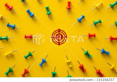 Target audience finding strategy with pushpins on yellow Target audience finding strategy with pushpins on yellow 135288257