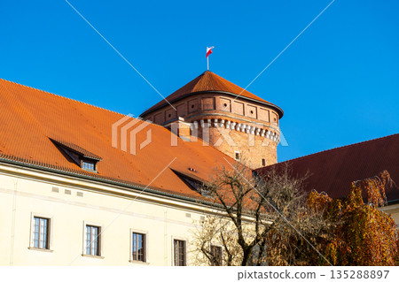Poland flag on Wawel Castle in Krakow. Tower old building architecture 135288897