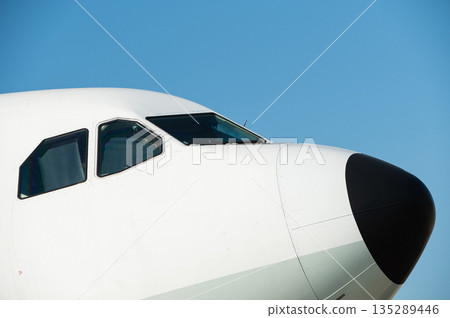 Close up of the cockpit windows and nose cone 135289446