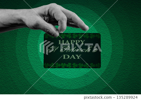 St. Patrick's Day calendar, March 17. Halftone collage: a hand holding a St. Patrick's Day greeting card. A symbol of good luck and success. St. Patrick's Day calendar, March 17. Halftone collage: a hand holding a St. Patrick's Day greeting card. A symbol of good luck and success. 135289924