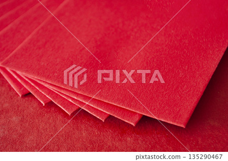 Multiple red envelopes layered together forming a clean Chinese New Year background. Multiple red envelopes layered together forming a clean Chinese New Year background. 135290467