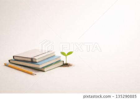 A simple background of school supplies and young leaves, representing long-term preparation for education funds 135290885