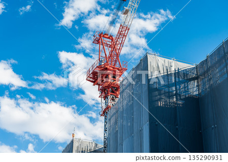 Construction site and crane against blue sky 135290931