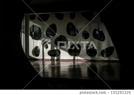 The sun light passes through the glass window to the floor and wall of studio dancing. 135291320