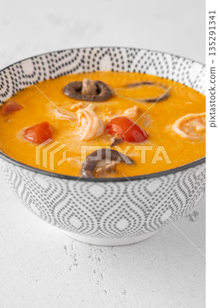 Creamy tom yum soup with shrimp coconut milk and herbs 135291341