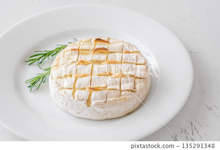 Baked camembert with toasted ciabatta garlic and rosemary garnish Baked camembert with toasted ciabatta garlic and rosemary garnish 135291348