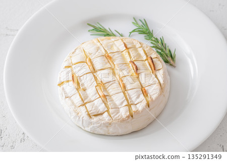 Baked camembert with toasted ciabatta garlic and rosemary garnish Baked camembert with toasted ciabatta garlic and rosemary garnish 135291349