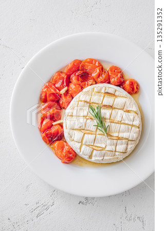 Baked camembert with rosemary garlic ciabatta and roasted cherry tomatoes plate gourmet white 135291352
