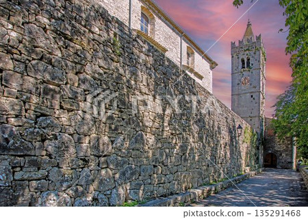 Medieval stone wall and church tower in Groznjan Istria 135291468