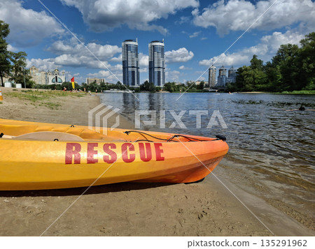 The rescue boat is stationed on the beach near the water The rescue boat is stationed on the beach near the water 135291962
