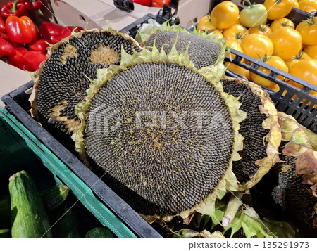 Sunflower heads with seeds at the grocery store Sunflower heads with seeds at the grocery store 135291973