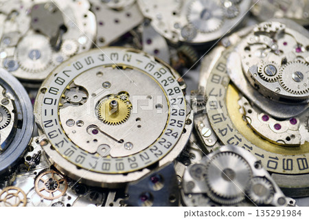 Old mechanical watches with gears and cogs. Watch or clock mechanisms 135291984