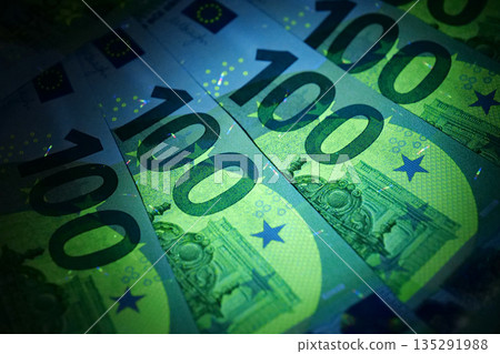 100 euro bills under ultraviolet light 135291988