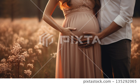 Man and woman holding pregnant bump expecting baby. Happy family hands on stomach closeup. Man and woman holding pregnant bump expecting baby. Happy family hands on stomach closeup. 135292065