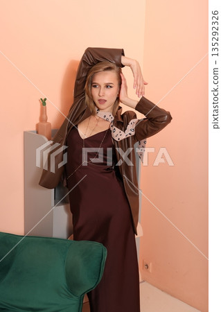 Graceful woman exuding sophistication in fashionable clothing scene Graceful woman exuding sophistication in fashionable clothing scene 135292326