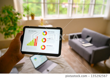 Checking data on a tablet Checking data on a tablet 135292567