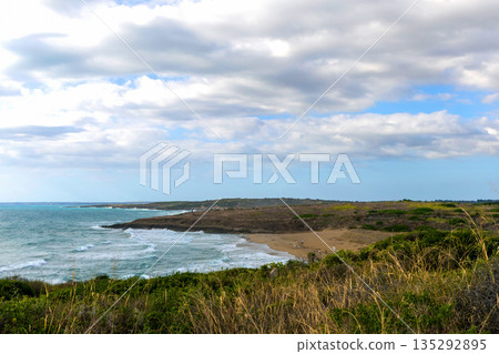 Sicilian coastline near Noto with green hills and sea. Sicilian coastline near Noto with green hills and sea. 135292895