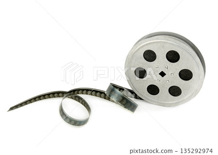Vintage Metal Movie Film Reel with Unspooled Film Strip on White Background Vintage Metal Movie Film Reel with Unspooled Film Strip on White Background 135292974
