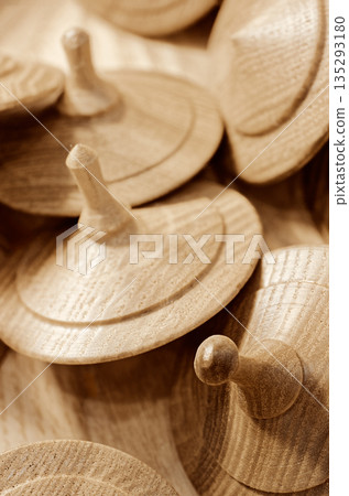 A lot of toy wooden spinning tops A lot of toy wooden spinning tops 135293180
