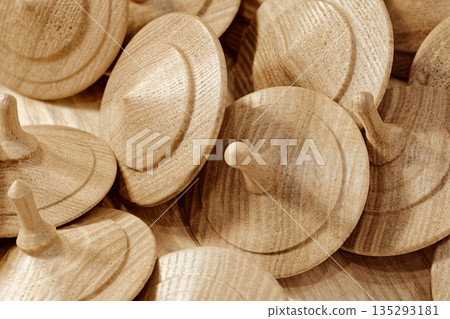 A lot of toy wooden spinning tops 135293181