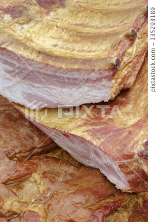 Smoked pork belly or brisket on the counter of a butcher shop Smoked pork belly or brisket on the counter of a butcher shop 135293189