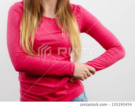 Woman chest, pink blouse and long hair Woman chest, pink blouse and long hair 135293454