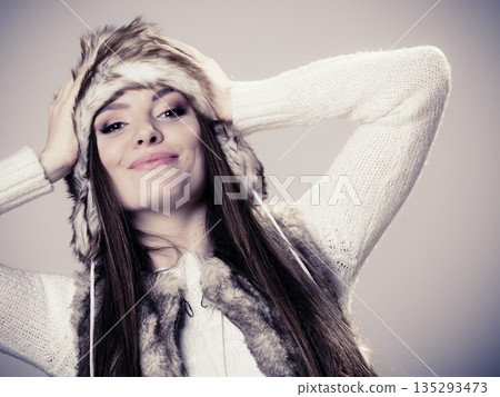 Young lady in winter hat 135293473