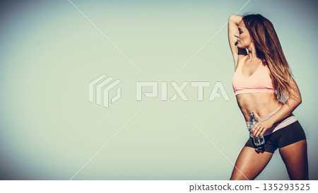 Woman with water after workout 135293525