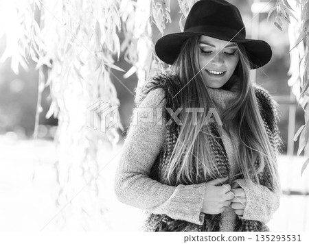 Attractive girl warm herself 135293531