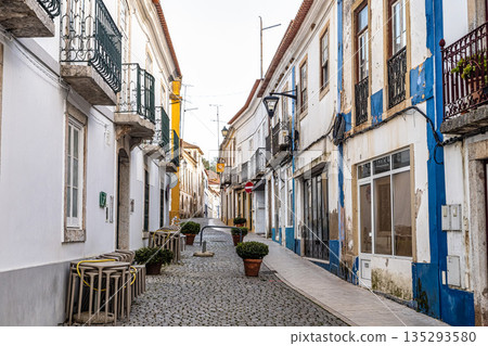 Narrow street at village Odemira, Portugal with old white houses in traditional Portuguese style Narrow street at village Odemira, Portugal with old white houses in traditional Portuguese style 135293580