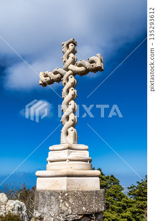 Cruz Alta or High Cross in Sintra, Portugal. It stands at the highest point in the Sintra hills in park of Sintra. Cruz Alta or High Cross in Sintra, Portugal. It stands at the highest point in the Sintra hills in park of Sintra. 135293612