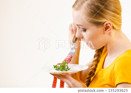 Sad young woman being on diet 135293625