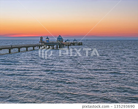 Groemitz pier under colorful evening sky Groemitz pier under colorful evening sky 135293690